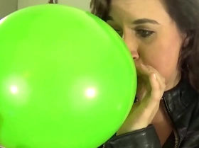 Blowing bubble gum bubbles and balloons while masturbating