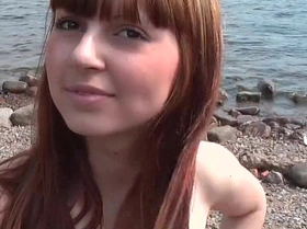 Red-haired girl fucked on the beach in front of everyone