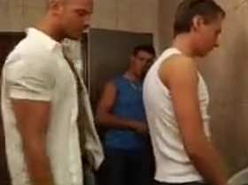 Young boy in toilet is fucked by 2 muscle studs