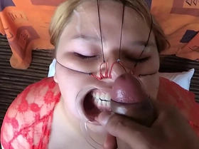 Cum on face in facial bondage scene