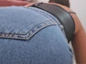 A seductive Latina maid arrives in a short dress, teasing with her curves and tattoos during steamy encounters.