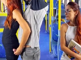 A seductive redhead in a skimpy skirt submits to a stranger on a bus, embracing exhibitionist thrills.